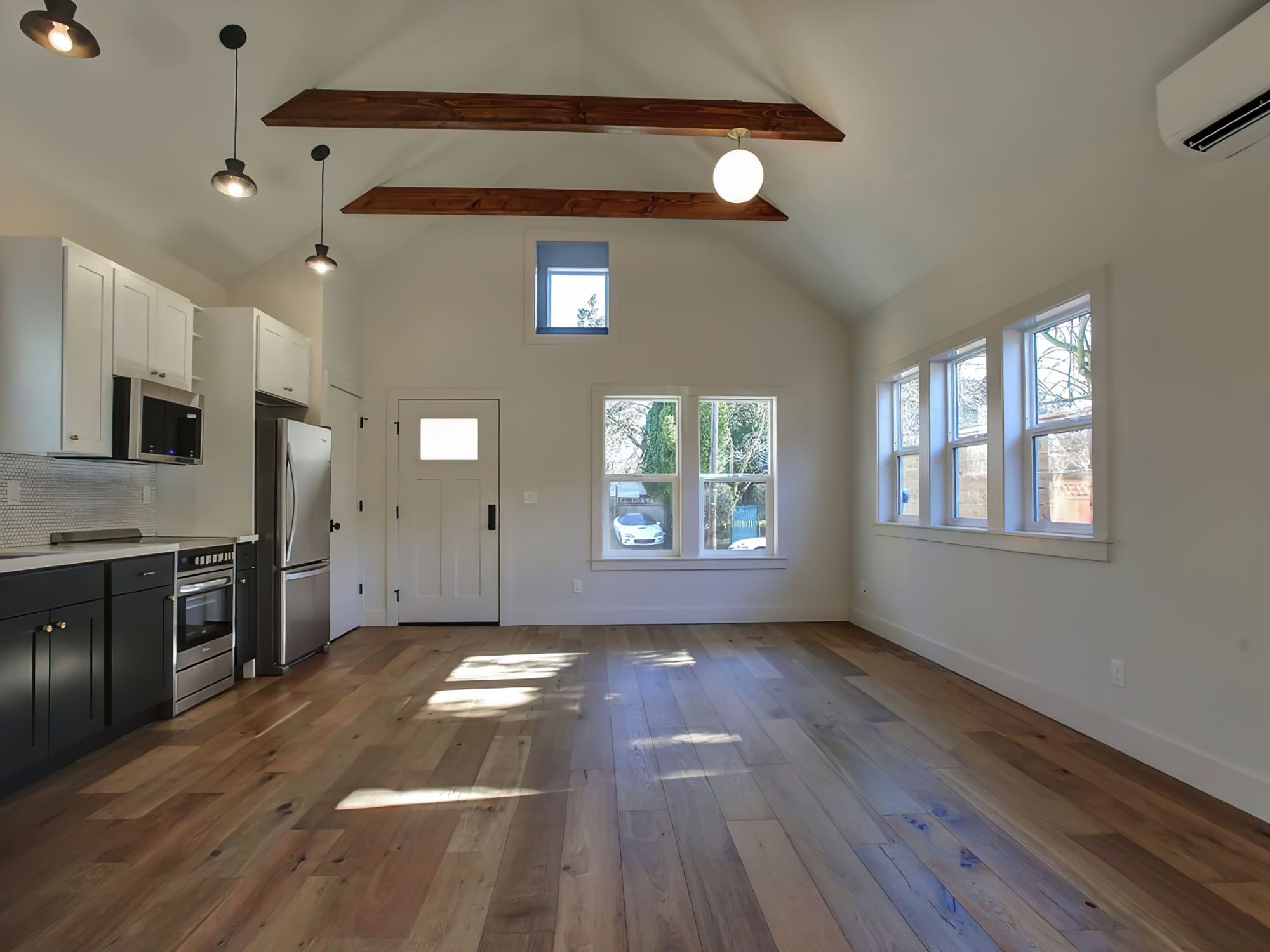 Renovations Services Quebec featuring an accessory dwelling unit (ADU) or secondary suite on a residential property, designed as an independent living space with its own kitchen, bathroom, and bedroom, often used for family members or rental purposes.