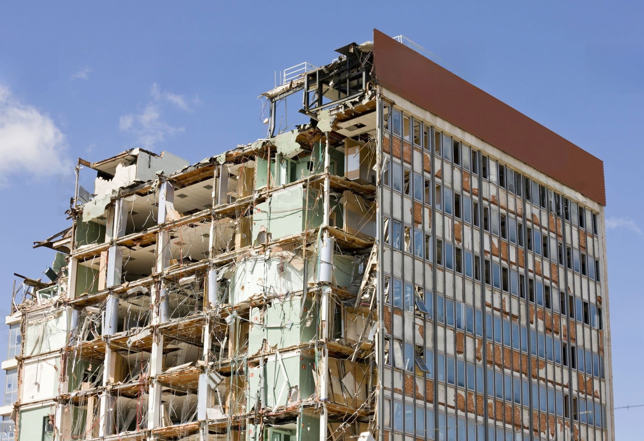 Commercial Demolition Quebec showing a partially collapsed building, symbolizing the controlled structural removal process during commercial demolition projects.