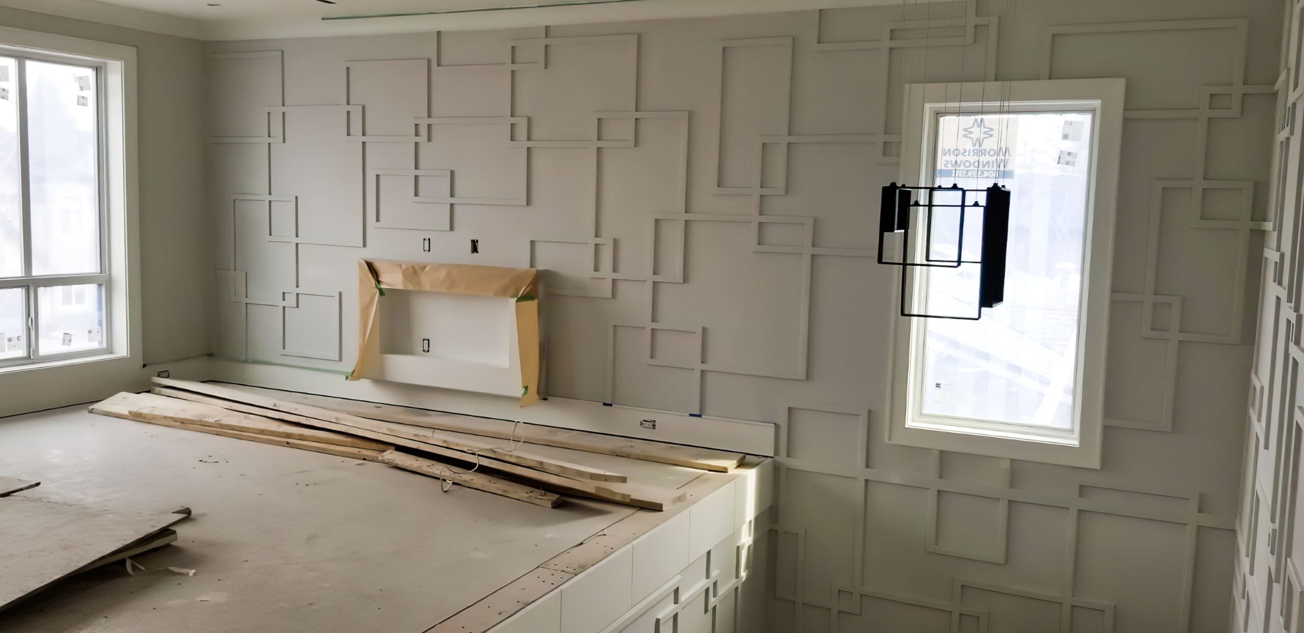 Feature wall under construction designed as an accent wall with unique color and texture, representing modern interior wall decoration in Quebec for stylish residential and office spaces.