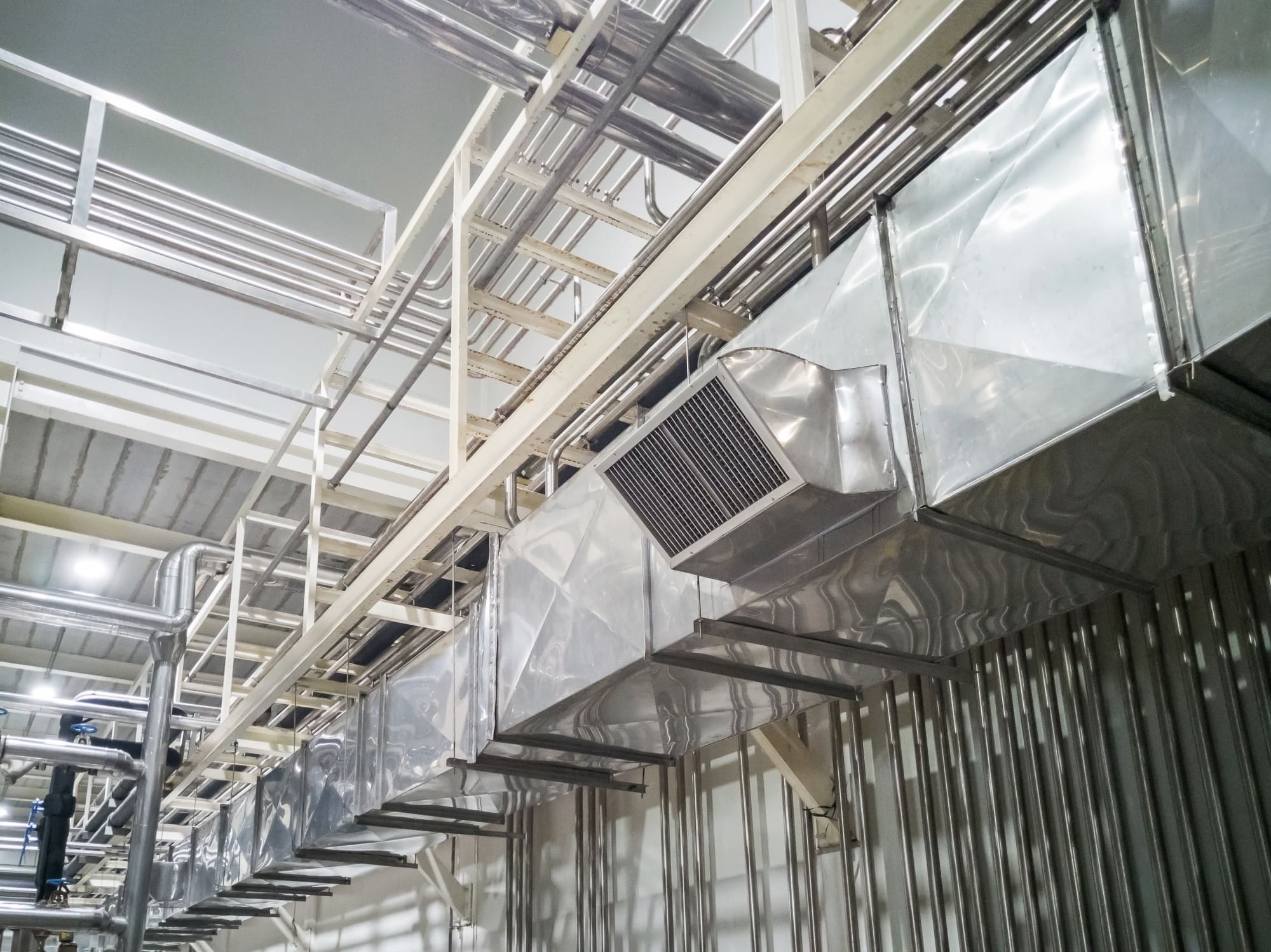 Industrial HVAC installation in Quebec showing ventilation ducts and climate control units designed to regulate temperature, humidity, and air quality in commercial or residential buildings.